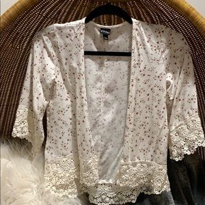 White floral lacey cardigan style blouse.